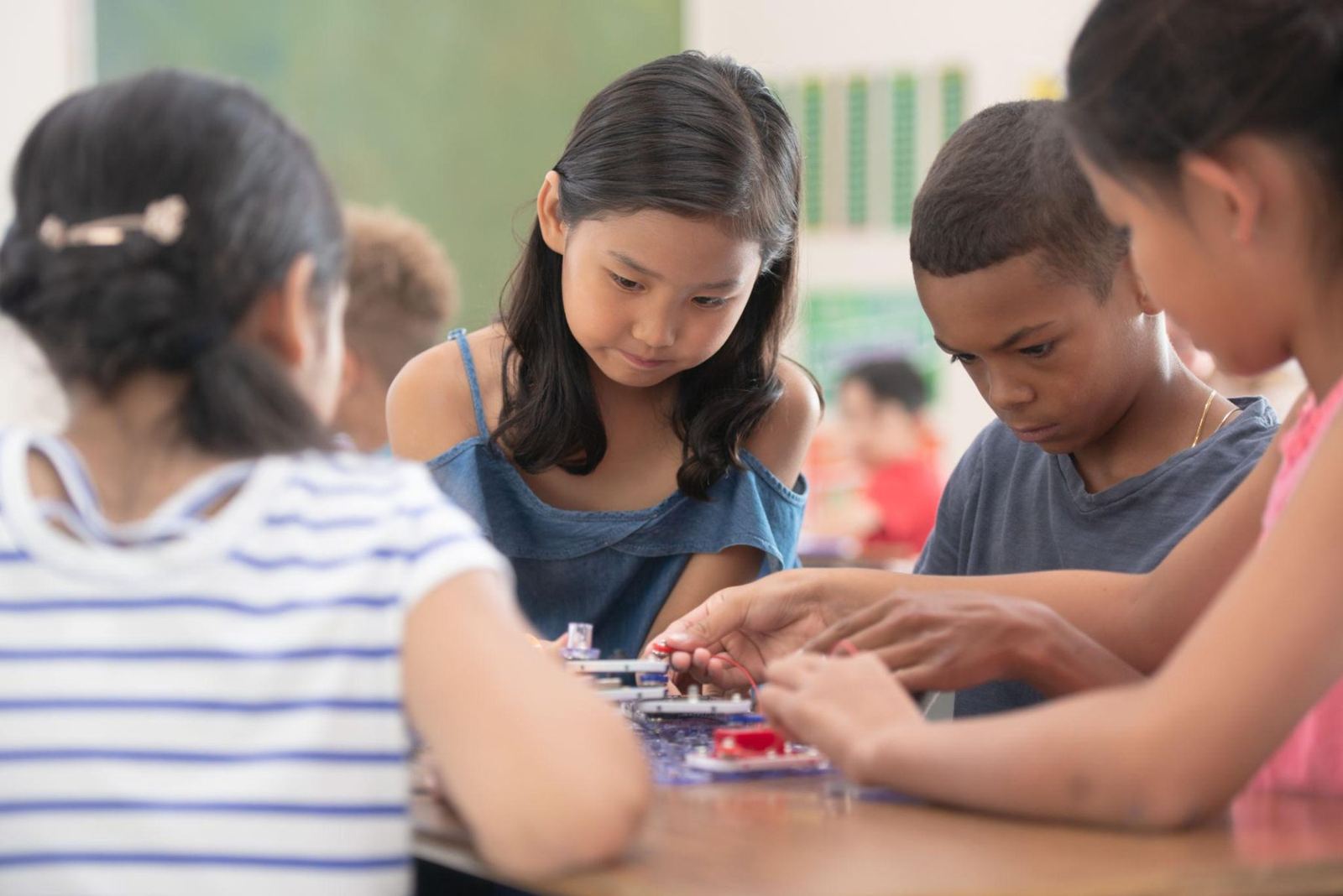 Older students collaborating on a hands-on project