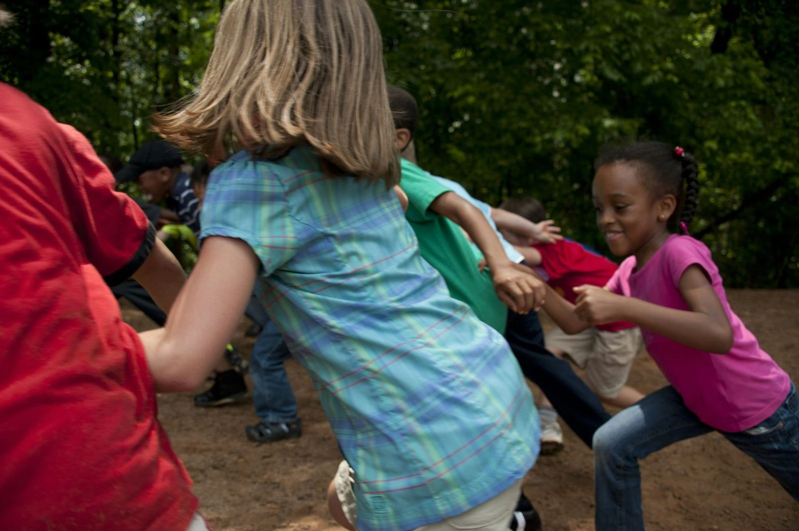 Children moving and playing together outdoors
